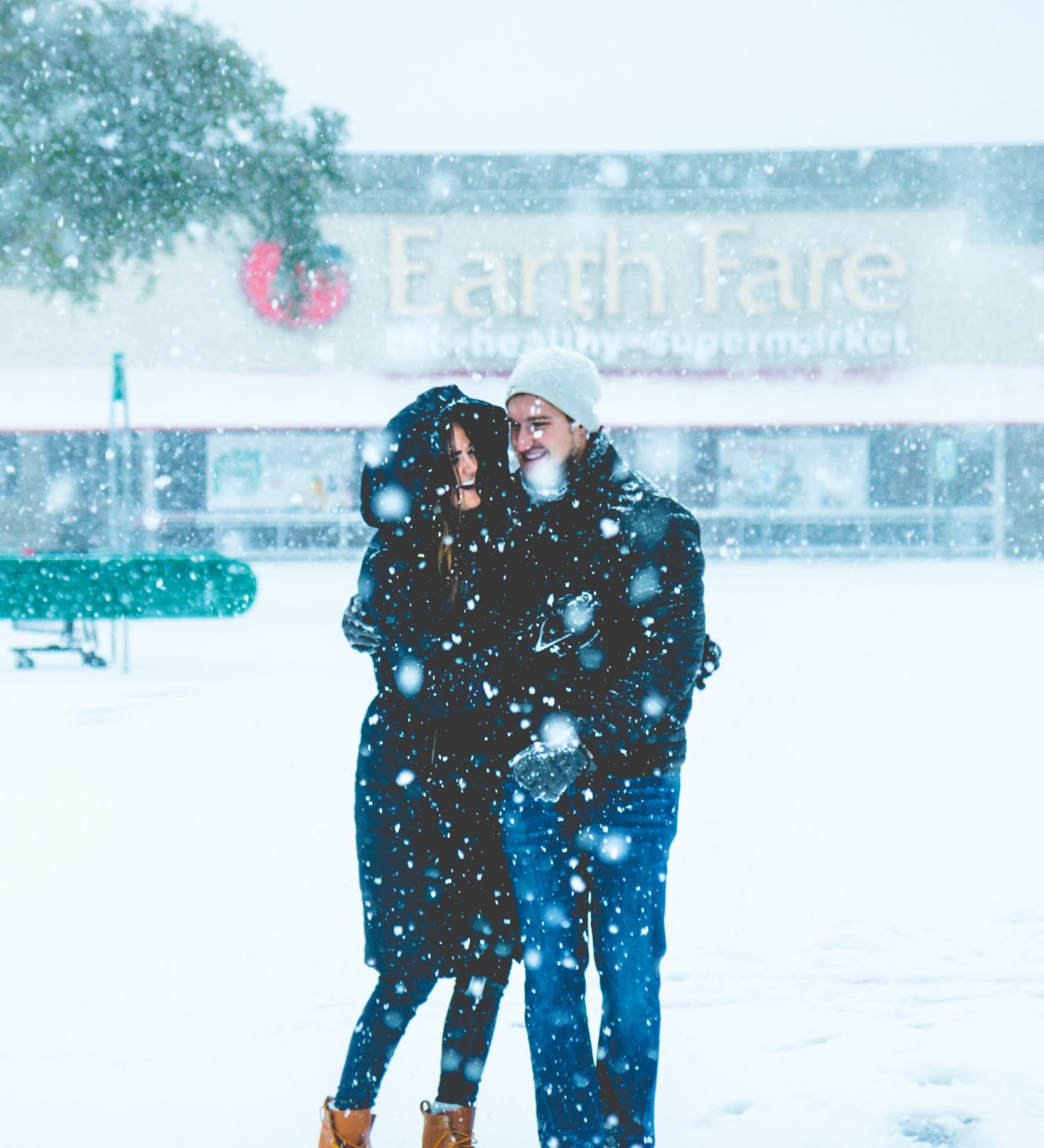 couple outside in snow on ice