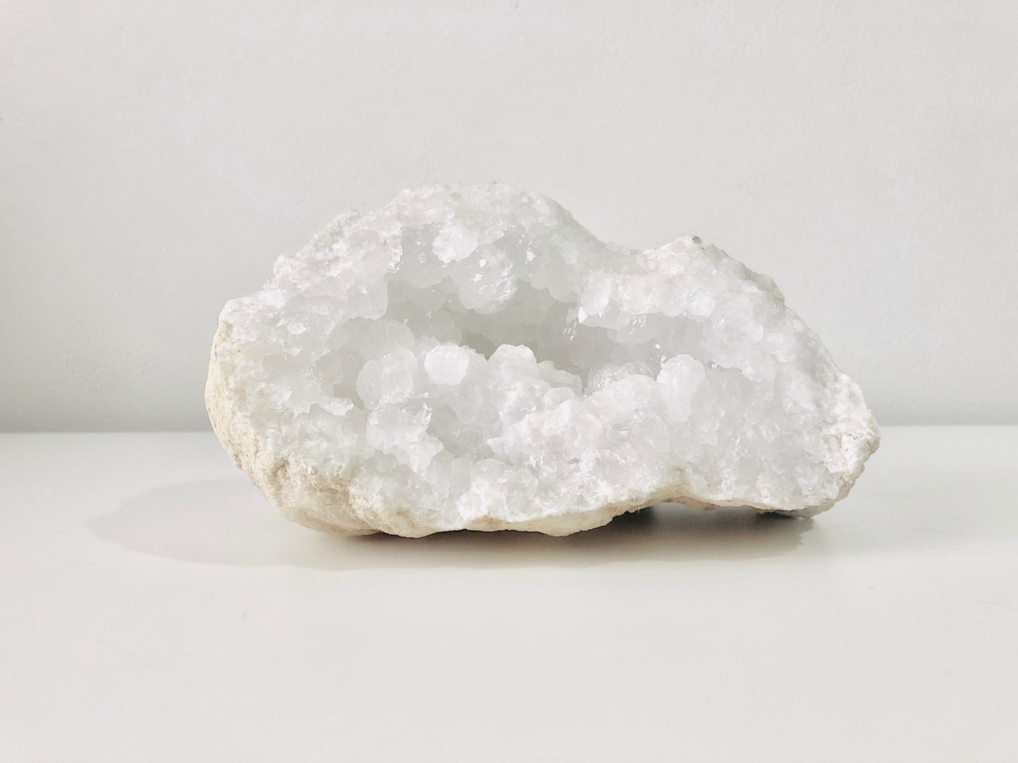 clear quartz rock against white background