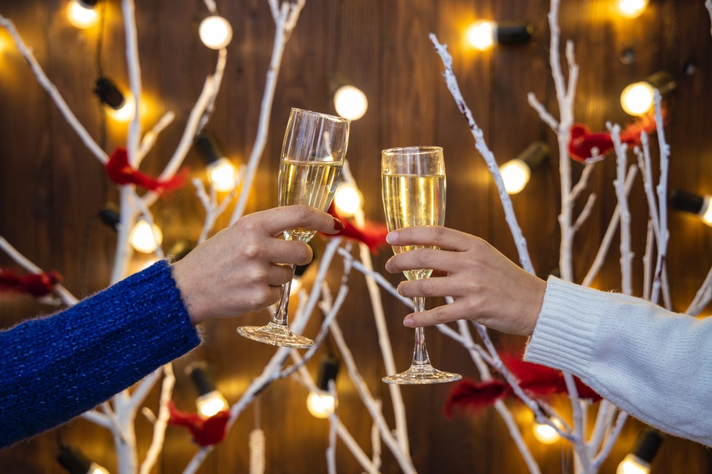 couple cheers with champagne during holidays